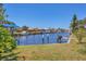 Picturesque waterfront view with boats docked along a canal lined with charming homes at 4405 Harbor Blvd, Port Charlotte, FL 33952