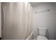 Bathroom features toilet and combined shower with shower curtain at 4580 Longwater # 61, Sarasota, FL 34235