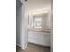 Bathroom vanity featuring marble countertop and mirror at 4580 Longwater # 61, Sarasota, FL 34235