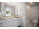 Bathroom vanity featuring marble countertop, mirror and combined shower and toilet at 4580 Longwater # 61, Sarasota, FL 34235