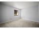 Bedroom with new carpet and a single window at 4580 Longwater # 61, Sarasota, FL 34235