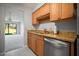 Kitchen showcases granite countertops, modern appliances, and wood cabinetry at 4580 Longwater # 61, Sarasota, FL 34235