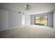 Comfortable living room area with golf course view, neutral paint and carpet flooring at 4580 Longwater # 61, Sarasota, FL 34235