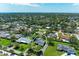 Aerial view of a home within a neighborhood, surrounded by mature trees at 4611 17Th W Ave, Bradenton, FL 34209