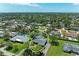 Aerial view of a home within a neighborhood, surrounded by mature trees at 4611 17Th W Ave, Bradenton, FL 34209