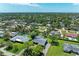 Aerial view of a home within a neighborhood, surrounded by mature trees at 4611 17Th W Ave, Bradenton, FL 34209