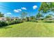 Expansive, well-maintained backyard with lush green grass and established landscaping at 4611 17Th W Ave, Bradenton, FL 34209