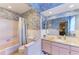 Unique bathroom with floral wallpaper, pink fixtures, and white tile accents at 4611 17Th W Ave, Bradenton, FL 34209