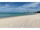A pristine white sand beach with beautiful turquoise water and a blue sky at 4611 17Th W Ave, Bradenton, FL 34209