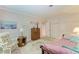 Inviting bedroom with a rocking chair, floral rug, and vintage dresser, exuding warmth and comfort at 4611 17Th W Ave, Bradenton, FL 34209