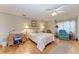 Inviting bedroom featuring hardwood floors, work desk, recliner, and ample natural light at 4611 17Th W Ave, Bradenton, FL 34209