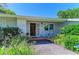 Inviting front entrance with a decorative wood door and a cozy seating area at 4611 17Th W Ave, Bradenton, FL 34209
