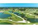 Aerial view of the beautifully designed golf course with serene water features, mature trees and well-maintained greens at 4611 17Th W Ave, Bradenton, FL 34209