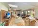 Bright living room boasts wood floors, skylights, and a brick fireplace at 4611 17Th W Ave, Bradenton, FL 34209