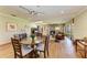 Open-concept living room with wood floors, brick fireplace, and cozy seating at 4611 17Th W Ave, Bradenton, FL 34209