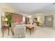 A formal living room with crown molding, light-green walls, and white carpets throughout the space at 4611 17Th W Ave, Bradenton, FL 34209