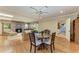 Cozy living room featuring wood floors, a brick fireplace, and a ceiling fan at 4611 17Th W Ave, Bradenton, FL 34209