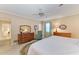 Comfortable bedroom with warm tones, wood furniture, and natural light at 4611 17Th W Ave, Bradenton, FL 34209