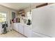 Utility room offers ample counter space, storage, and modern appliances at 4611 17Th W Ave, Bradenton, FL 34209
