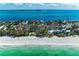 An aerial view of the property highlighting its location on a pristine beach at 5055 Gulf Of Mexico Dr # 232, Longboat Key, FL 34228