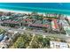 Aerial view of the community with tennis courts and pool, set by the ocean at 5055 Gulf Of Mexico Dr # 232, Longboat Key, FL 34228
