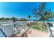 Charming balcony view overlooking tropical landscaping, a sparkling community pool, and the Gulf of Mexico at 5055 Gulf Of Mexico Dr # 232, Longboat Key, FL 34228