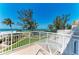 Relaxing balcony view of the lush landscape and ocean at 5055 Gulf Of Mexico Dr # 232, Longboat Key, FL 34228