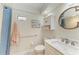 Bathroom with walk-in shower, grab bar, and modern fixtures at 5055 Gulf Of Mexico Dr # 232, Longboat Key, FL 34228
