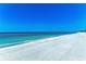 A sunny day at the beach with clear blue sky and turquoise water at 5055 Gulf Of Mexico Dr # 232, Longboat Key, FL 34228