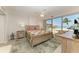 Bright main bedroom with slider to balcony overlooking the Gulf of Mexico at 5055 Gulf Of Mexico Dr # 232, Longboat Key, FL 34228