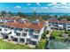 An exterior shot of the beachside villas featuring balconies and covered parking at 5055 Gulf Of Mexico Dr # 232, Longboat Key, FL 34228