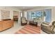 Comfortable Florida room with wicker furniture, ocean view, and access to bedroom at 5055 Gulf Of Mexico Dr # 232, Longboat Key, FL 34228