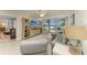 Bright living room featuring a large slider to the balcony with beautiful ocean views at 5055 Gulf Of Mexico Dr # 232, Longboat Key, FL 34228