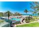 Stunning community pool with beach and manicured grounds at 5055 Gulf Of Mexico Dr # 232, Longboat Key, FL 34228