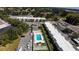 A picturesque aerial view of the condo complex shows the refreshing community pool at 519 Albee Farm Rd # 201, Venice, FL 34285