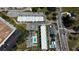 High-angle view capturing the building layout with pool, parking, and surrounding community at 519 Albee Farm Rd # 201, Venice, FL 34285
