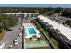 Aerial view features a sparkling community pool and meticulously kept grounds at 519 Albee Farm Rd # 201, Venice, FL 34285