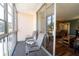 Outdoor balcony with seating, offering natural light into the living area at 519 Albee Farm Rd # 201, Venice, FL 34285