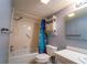A full bathroom with a tub and shower combination, a white vanity, and a mirrored wall cabinet at 519 Albee Farm Rd # 201, Venice, FL 34285