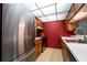 A well-equipped kitchen features stainless steel refrigerator and ample counter space at 519 Albee Farm Rd # 201, Venice, FL 34285