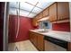 Functional kitchen with a stainless-steel refrigerator and well-maintained appliances at 519 Albee Farm Rd # 201, Venice, FL 34285