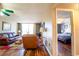 Inviting living room with wood floors, comfortable leather seating, and sliding glass doors at 519 Albee Farm Rd # 201, Venice, FL 34285