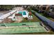 A tranquil pool area with shuffleboard is beautifully landscaped and ready for relaxation at 519 Albee Farm Rd # 201, Venice, FL 34285
