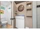 This bathroom features a modern vanity, unique round mirror, and tiled floors for a stylish, updated look at 528 45Th St, Sarasota, FL 34234