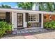 Inviting front porch with stone accents, brick details, and attractive house number at 528 45Th St, Sarasota, FL 34234