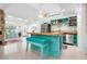 Kitchen with turquoise kitchen island, stainless steel appliances, and open floor plan at 528 45Th St, Sarasota, FL 34234