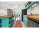 Charming kitchen with wood countertop, stone fireplace, and stainless steel appliances at 528 45Th St, Sarasota, FL 34234