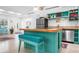 Kitchen featuring a bright turquoise island, modern appliances, and open layout at 528 45Th St, Sarasota, FL 34234