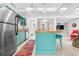 Open kitchen design with modern appliances and a breakfast bar seating area at 528 45Th St, Sarasota, FL 34234