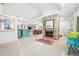 Bright and spacious living area with a stone fireplace, open floor plan, and ample lighting at 528 45Th St, Sarasota, FL 34234